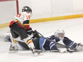 Upper Ottawa Valley Aces goaltender Cooper Gould dives towards a lose puck in the slot during the AA division final against the Belleville Bulls during the U13 weekend at the 38th Annual Terry O'Neill Pembroke Regional Silver Stick Tournament. Anthony Dixon