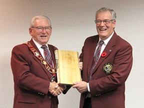 Retiring Mayor Bob Sweet (left) and retiring Councillor Tom Mohns share a laugh as plaques commemorating their service were presented during their final council meeting earlier this month. Together they have more than half a century of combined service to the town. Anthony Dixon