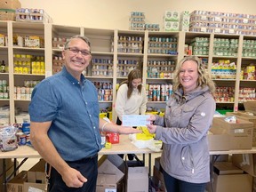 Township of Laurentian Valley planning and recreation co-ordinator Navada Sargent, right, presents a cheque for $310 to Rene Lachapelle, president of the St. Joseph's Food Bank. The money was raised through the Township of Laurentian Valley Community Garden's 1st season.