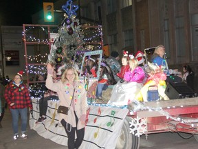 The float from Our Lady of Lourdes Catholic School rolls along the parade route near Pembroke city hall during the Santa Claus parade on Nov. 26. Anthony Dixon