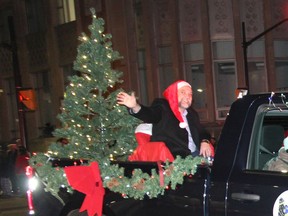 Ron Gervais, the new mayor of Pembroke, waves to the crowd during Pembroke's Santa Claus parade. Anthony Dixon
