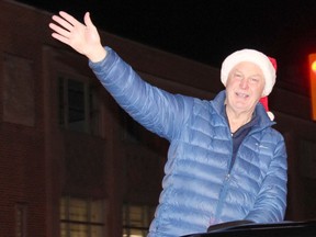 Renfrew-Nipissing-Pembroke MPP John Yakabuski has a big merry Christmas smile as he rolls along in the parade route during Pembroke's annual Santa Claus parade. Anthony Dixon