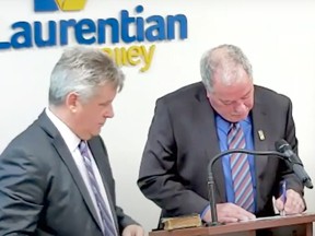 Laurentian Valley CAO Dean Sauriol looks on as Mayor Steve Bennett signs his declaration of office during the new council's inaugural meeting on Nov. 22.