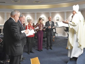 Bishop of Pembroke Guy Desrochers guides Renfrew County Catholic District School Board trustees in the Rite of Renewal prior to the board's inaugural meeting on Nov. 21.