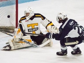 Woodstock's Eric Tuori beats Tavistock's James Hopper with a shot during the PJHL game this season at Southwood Arena.