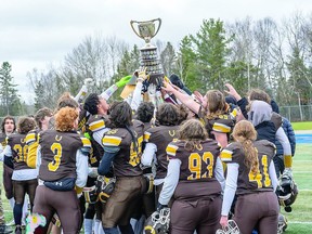 HAIL TO THE NOSSA CHAMPS Members of the Korah Colts celebrate their recent NOSSA senior high school football championship victory over the North Bay Algonquin Barons. BOB DAVIES