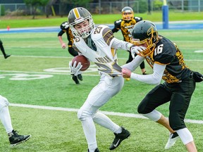 KORAH CAPTURES NOSSA CROWN Hunter Dickinson of the Korah Colts pulls free of Kadin Broomhead of the Lively Hawks during NOSSA junior high school football championship game action from the weekend. Korah upended Lively 49-7 to cop the NOSSA crown. BOB DAVIES