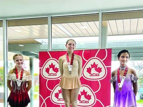 Yvonne Barnes of Lake Superior Figure Skating Club take the centre spot among medalists at a recent Ottawa area competition. PHOTO SUBMITTED
