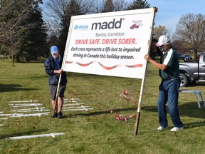 MADD Sarnia-Lambton volunteers help with the white cross campaign in Bright's Grove in 2020. This year's cross display is planned along the St. Clair Parkway, just south of the Aamjiwnaang First Nation sign. (Submitted)