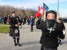 Pipe Mayor Tom Rankin and the Sarnia Legion Pipe Band take part in Thursday's Remembrance Day service at the Aamjiwnaang First Nation in Sarnia.