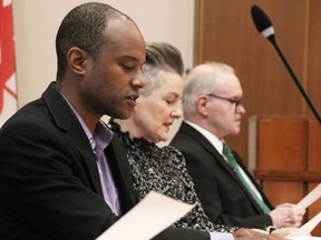 Coons.  Adam Kilner, left, Chrissy McRoberts and Terry Burrell read the oath of office at the 2022-2026 Sarnia city council inaugural meeting Nov. 15, 2022. (Tyler Kula/ The Observer)