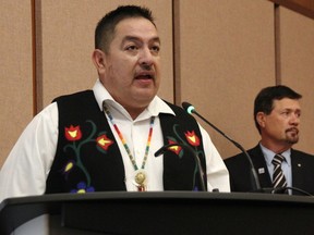 Aamjiwnaang First Nation Chief Chris Plain leads the inaugural meeting of Sarnia's 2022-2026 city council Nov. 15, 2022. Lambton County Warden Kevin Marriott looks on.  (Tyler Kula/ The Observer)