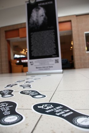 Footsteps lead to one of 10 posters featuring nine survivors in Lambton Mall, up for the next six weeks as part of this year's Walk a Mile campaign for the Women's Interval Home of Sarnia-Lambton.  (Tyler Kula/ The Observer)