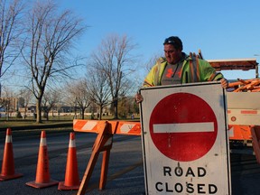 City of Sarnia employee James Smith sets up a road closed sign prior to the Sarnia-Lambton's Celebration of Lights event Saturday afternoon.  Terry Bridge/Sarnia Observer/Postmedia Network