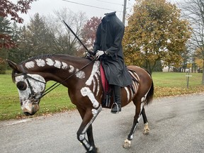 A Halloween tradition continued in Port Ryerse on Monday when the Headless Horseman (Charlotte Elliott) traveled the streets of the community in Norfolk County.  SIMCOE REFORM PHOTO
