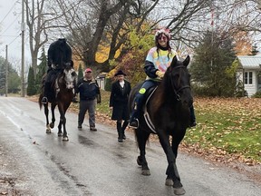 Karen Smout, on horse Yazhi, was dressed as a hippie as she led the Headless Horseman procession through the streets of Port Ryerse in Norfolk County on Halloween (Monday).  Charlotte Elliott, on horse Freebird, once again gave the Headless Horseman costume while Lorraine Fletcher dressed as Ichabod Crane.  Adam Elliott, Charlotte's husband, was also part of the group.  SIMCOE REFORM PHOTO
