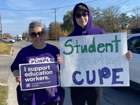 Marcela Caro, a teacher at Houghton Public School, joined the picket line along Queensway East in Simcoe during her lunch hour Friday, Nov. 4. Caro came out in a show of support for striking education workers.  She was joined by her son Alexander Siemens Caro, a student at Holy Trinity Catholic High School in Simcoe.