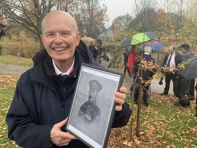 David Judd holds a photo of his grandfather Charles Judd, a member of an engineering battalion that laid down wooden plank "roads" through the muck of France during the First World War and was at Vimy Ridge. Members of the Judd family gathered for the ceremonial planting of a Vimy Oak tree in Wellington Park following Friday's Remembrance Day service in Simcoe.