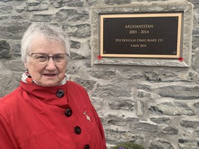 Silver Cross Mother Judy Klages placed a poppy on a plaque dedicated to her son Petty Officer 2nd Class Douglas Craig Blake, who was killed in action in Afghanistan on May 3, 2010. The plaque has been added to the Norfolk War Memorial Carillon Tower in Simcoe .  Klages, of Woodstock, also placed a wreath during Friday's Remembrance Day ceremony on behalf of all Silver Cross Mothers.  VINCENT BALL