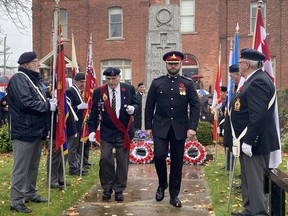 Scott Puillandre, right, placed the wreath on behalf of Afghan war veterans during the Waterford Remembrance Day service on Friday.  SIMCOE REFORM PHOTO