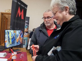 Greg and Sharon Butcher of Tillsonburg visited the Marwood International booth at the Grand Erie Aspire Job Fair in Delhi Wednesday afternoon. Marwood has about 200 potential openings across their seven locations, including Tillsonburg. CHRIS ABBOTT