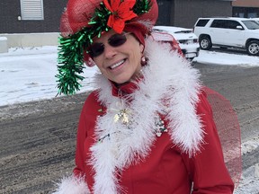 Ev Deming, parade marshal for the Port Dover Christmasfest Santa Claus parade, got into the spirit of the season wearing a bright red Christmas coat and hat on Saturday, Nov. 17. VINCENT BALL