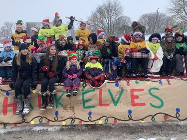Students from St. Cecilia School in Port Dover were among the many participants who braved the chilly temperatures and snow squalls to participate in Saturday's Christmas Festival and Santa Claus Parade in Port Dover. VINCENT BALL
