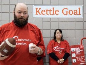 Stephen Frank, corps officer with the Salvation Army Simcoe, prepares to kick off Norfolk's Christmas Kettle Campaign in Simcoe on Friday, Nov. 17 with a ceremonial football kick-off.  CHRIS ABBOTT