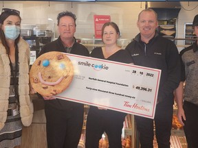 All Smiles! From left, Penny Bellhouse, executive director of the Norfolk General Hospital Foundation, Tim Hortons store owners Grant Nelson, Hilary Robertson, Steve Salverda and Tim Hortons employee Brendhan Nelson were on hand for the presentation of a $49,396.31 donation to the foundation. The proceeds from this year's Smile Cookie campaign which ran in September. CONTRIBUTED PHOTO