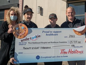Lisa Hostein, from left, executive director of the West Haldimand Hospital and Healthcare Foundation, has something to smile about after accepting almost $29,000 from this year's Tim Hortons Smile Cookie campaign.  On hand for the presentation were Tim Hortons staff members Jenelle Fess and Kerrie Swain along with Shaun Salverda, owner of the Jarvis and Hagersville Tim Hortons restaurants.  CONTRIBUTED PHOTO