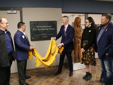 Cambrian College board chair Jeff Smith, left, Gianni Grossi, president of Anmar Mechanical and Electrical Contractors, Cambrian College president Bill Best, Angele Chartrand, president of Cambrian College's Indigenous Student Circle, and Shawn Sobush, Indigenous relations and business at Anmar Mechanical and Electrical Contractors, unveil a plaque at a ceremony for the official opening of the Wiidokaaziwin (The Gathering Place) at the college in Sudbury, Ont. on Thursday November 10, 2022. Details of the Anmar Mechanical Indigenous Student Support Program were also announced at the event. John Lappa/Sudbury Star/Postmedia Network