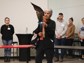 Elder Leland Bell (Mishomis) of Cambrian College's Wabnode Centre for Indigenous Services, performs a prayer at a ceremony for the official opening of the Wiidokaaziwin (The Gathering Place) at the college in Sudbury, Ont. on Thursday November 10, 2022. John Lappa/Sudbury Star/Postmedia Network