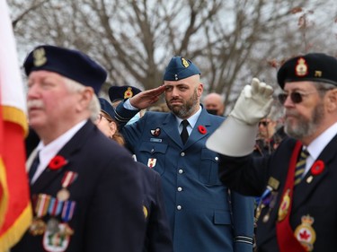 Capt. Devyn Gagnon, middle, of the Canadian Forces Recruiting Centre, salutes at a Remembrance Day Service at Branch 76 in Sudbury, Ont. on Friday November 11, 2022. John Lappa/Sudbury Star/Postmedia Network
