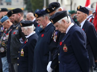 Legion members bow their heads during a moment of silence at Branch 564 of the Royal Canadian Legion Remembrance Day Service at the Memorial Park Cenotaph in Sudbury, Ont. on Friday November 11, 2022. John Lappa/Sudbury Star/Postmedia Network