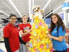 Department manager Shabnam Malik and Emmet Thomson, of Toys R Us, joined Lynne Ethier, right, manager of fundraising and community engagement at Our Children, Our Future, to launch the Tree of Dreams Toy Drive at Toys R Us in Sudbury, Ont. Our Children, Our Future and Toys R Us Sudbury have joined forces to ensure that less fortunate children in the Sudbury area will receive a gift on Christmas Day. People can support the toy drive by choosing an ornament from the Tree of Dreams with a child's name on it, then purchase a gift for that child and a Toys R Us associate will place the ornament and the unwrapped gift in a bag, which will then make its way to the child for Christmas. The toy drive wraps up December 12. John Lappa/Sudbury Star/Postmedia Network