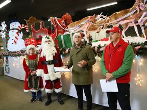 Parade publicity liaison Kyle Marcus, second right, makes a point as parade co-chair Rick Carr and Mrs. Claus and Santa Claus look on during a press conference for the 2022 Greater Sudbury Santa Claus Parade in Sudbury, Ont. on Tuesday November 15, 2022. The parade will be held in downtown Sudbury on Nov. 19 starting at 5:30 p.m.