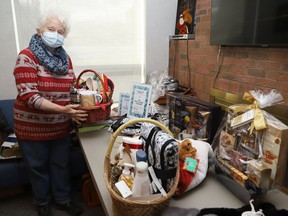 Hermina Hubert organizes items for a penny table that will be featured at the Ukrainian CentreÕs holiday bake sale and bazaar at the centre in Sudbury, Ont. on December 4, 2022, from 11 a.m. to 2 p.m. The event will included baked goods such as pumpkin loaf, orange cranberry loaf, banana loaf, gluten-free pecan tarts, butter tart square, butterscotch confetti squares, gingerbread cookies, shortbread, as well as Ukrainian sweets. Fresh pyrohy and cabbage rolls will also be for sale. John Lappa/Sudbury Star/Postmedia Network