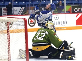 Ethan Larmand, of the Sudbury Wolves, reacts after missing a chance to score on Charlie Robertson, of the North Bay Battalion, during OHL action at the Sudbury Community Arena in Sudbury, Ont. on Wednesday November 30, 2022. John Lappa/Sudbury Star/Postmedia Network