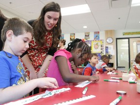 In thie file photo, Fionna Tough of the Sudbury Community Garden Network helps students Mac Gorrie-Martin and Gabrielle Tatem Fokam plant carrot seeds at the launch of  the Choose to Boost Veggies and Fruit initiative. Gino Donato