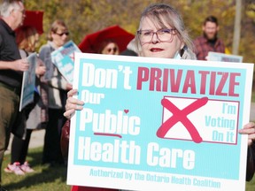 Shirley Roebuck with the Sarnia-Lambton Health Coalition organized a demonstration outside Sarnia-Lambton MPP Bob Bailey's office in Point Edward on Nov. 3, 2022. (Tyler Kula/Sarnia Observer)