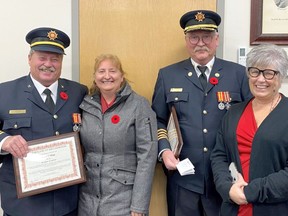 Captain Don Viau and his wife Denise and Deputy Chief Tom Cassidy and his wife Rhonda were recognized for their sacrifices made in the decades the men served on the Cochrane Fire Department.