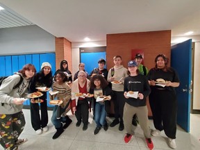Students from ESCHS get ready to chow down on a spaghetti lunch on the feast part of the Feast or Famine project that they participated in to raise funds and food for the Food Bank.