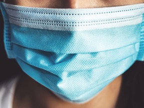 Public health officials are urgent area residents to begin wearing masks again to help stop the spread of illness while a 