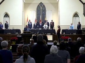 Members of Owen Sound city council for the 2022-2026 term take the stage at the Harmony Centre for the declaration of office and inaugural meeting Monday night in front of a crowd of friends, family, city staff and members of the public. Greg Cowan/The Sun Times
