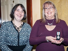 Alberta Museums Association president Sarah Newstead presented Millet Museum executive director/ curator Tracey Leavitt (right)with a Queen Elizabeth II Platinum Jubilee Medal last week.