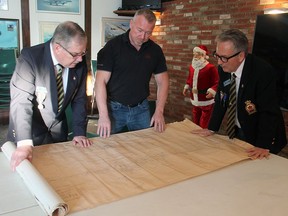 Wetaskiwin Royal Canadian Legion Br. No. 86 executive Rick Towler and president Ken Schubert look over the blueprints for the HMCS Wetaskiwin with Veterans Voices Canada founder Al Cooper last week.
Christina Max