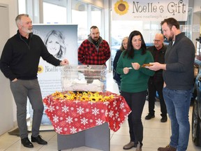 Members of the Paquette family announced the winners of Noelle’s Gift third annual Vehicle and Cash Draw at Finch Ford Lincoln on Dec. 28. From left to right: Finch Ford Lincoln’s Mark Guy, Joe Paquette, Lynn Paquette, Nicole Paquette, Roger Paquette and lawyer Martin Riley. 
Carl Hnatyshyn/Sarnia This Week