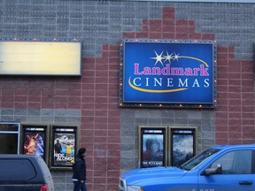 A man walks past Landmark Cinemas in downtown Fort McMurray Alta. on Saturday January 30, 2016. Vincent McDermott/Fort McMurray Today/Postmedia Network