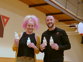 Wellspring Stratford is launching its third annual Light Up fundraiser to raise money for its no-cost cancer support programming for those who are battling cancer and their families. Pictured, Wellspring Stratford manager Lisa Stacey and Jason Colquhoun, operations manager at the Stratford YMCA where Wellspring will host a Light Up yoga fundraiser event on Dec. 8, hold the paper candles that area residents can purchase for $20 to honour or remember their loved ones who battled or are battling cancer. (Galen Simmons/The Beacon Herald)