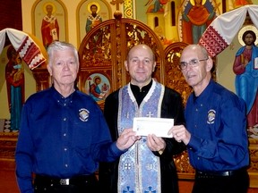 Grand Knight Mark Butler and Knights of Columbus member Ken Fediuk of Council 1387 present a cheque for $4,500 to Father Peter Bodnar, pastor at St. Mary’s Ukrainian Catholic Church, for the installation of a camera to stream all masses and services. “We are very pleased to be able to help update the wifi system for St. Mary’s church,” the Knights of Columbus said in a media release. “Council 1387 knows that this update will be used to help parishioners who are house bound.” Installing such a camera at Christ the King yielded positive results, the order said, as it allowed parishioners to follow services even when they could not attend in person for two years due to the COVID-19 pandemic.